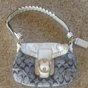 Small blue with white leather Coach purse.